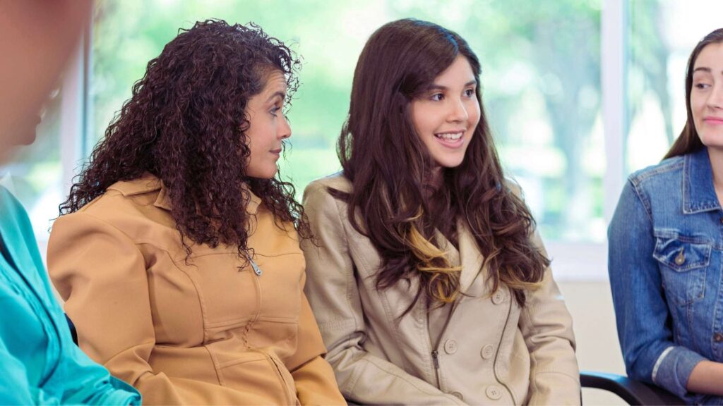 Teens participating in a supportive group session during rehab aftercare.